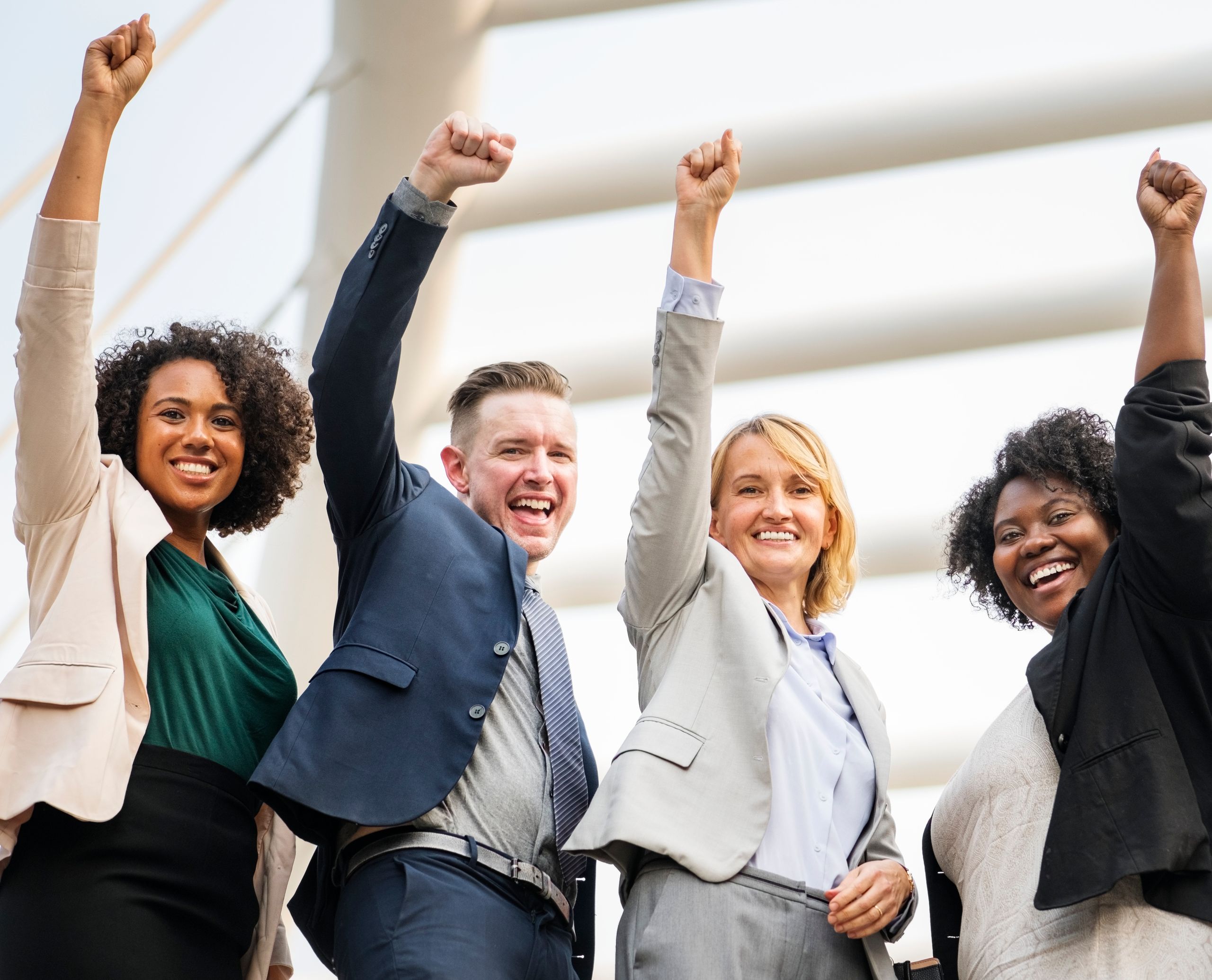 Diverse group celebrating transformation success